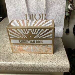 Christian Dior Gold and White cosmetic bag.